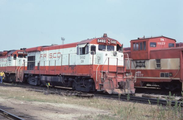 B30-7 5492 (Frisco 870) and Caboose 11677 (Frisco 1702) at St. Louis, Missouri on August 23, 1981